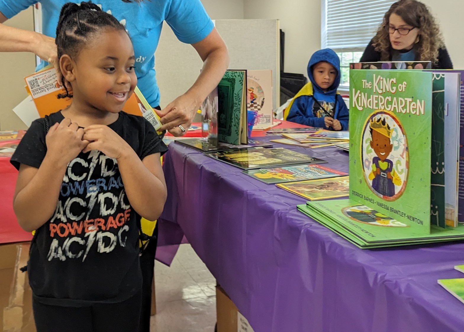 Pre-K students participating in Books On Break, where they get to choose and keep books to read over the summer.