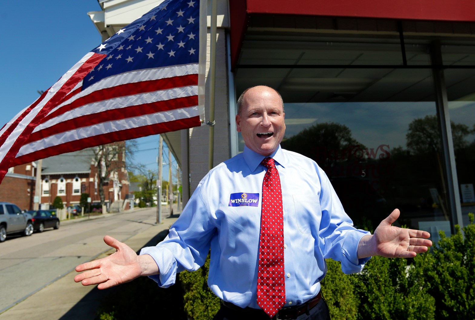 Dan Winslow in front of an american flag