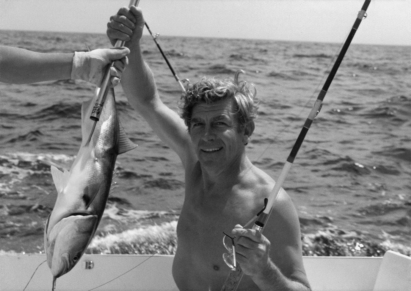 Andy Griffith holding a fish in Manteo